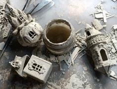 several pieces of clay sitting on top of a table