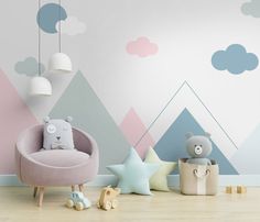 a child's room decorated in pastel colors with mountains and clouds painted on the wall