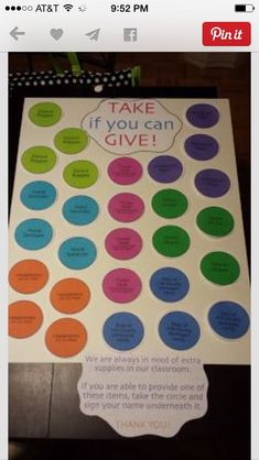 a sign that says take if you can give with colorful circles and words on it