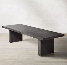 a concrete bench sitting on top of a hard wood floor