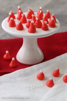 small red and white candies on a cake plate