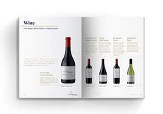 an open wine book with three bottles of wine on the cover and one bottle of wine in the middle