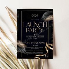 a black and gold party flyer with palm leaves on the side, next to a plant