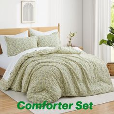 the comforter set is neatly made and ready for someone to use in their bed