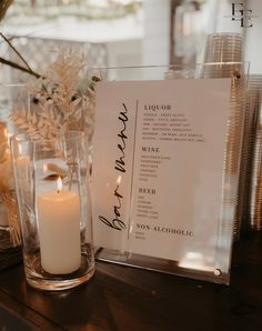 a table with candles and menus on it