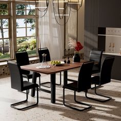 a dining table with four chairs in front of large windows and an open floor plan