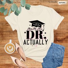 It's Dr Actually Shirt, Gift For New Doctor, PhD Graduation Gift, Doctor Appreciation Gift, PhD Graduation Shirt,PhD Gift For Her,Grad Gifts Hello there! Prior to placing your order, please ensure that you've thoroughly read and understood all the details provided and checked all pictures on the listing for sizing information. The personalization box is exclusively reserved for specifying design preferences, in line with the images provided. Unfortunately, we're unable to accommodate customizati Phd Party, Doctor Appreciation Gifts, Phd Gifts, Phd Graduation Gifts, Phd Graduation, Graduation Shirt, Graduation Shirts, Grad Gifts, Hello There