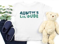 Auntie's Lil Dude Shirt, Toddler Boy Gift From Aunt, New Aunt Gift For Kids, Favorite Aunt Apparel, I Love My Aunt Clothing, Materials: White, Natural & Pink: 100% cotton H. Gray: 90/10% cotton/polyester Production time: 1-3 business days Shipping time: 2-6 days Delivery time: Usually within 3-9 days depending on your location and selected shipping service. Care Instruction: Inside out, wash with delicate cycle. Lay flat to dry Do not bleach Do not iron directly onto the design Do not dry clean SoGoodKids to see more from our shop, please visit https://www.etsy.com/shop/SoGoodKids Aunt Clothes, I Love My Aunt, Toddler Boy Gifts, New Aunt, Aunt Gifts, Gift For Kids, Kids Tops, Toddler Boys, Lay Flat