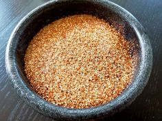 a bowl filled with brown sugar on top of a table