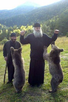 an old man standing next to two bears