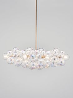 a chandelier with bubbles hanging from the ceiling