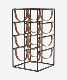 a black metal rack with brown ribbons hanging from it's sides and on the inside