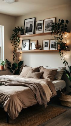 a bed sitting in a bedroom next to a window with plants on top of it