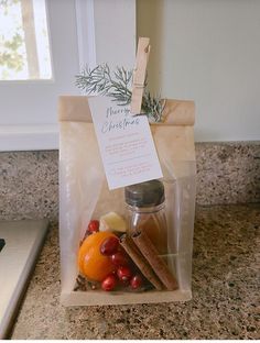 a bag filled with fruit and spices sitting on top of a counter