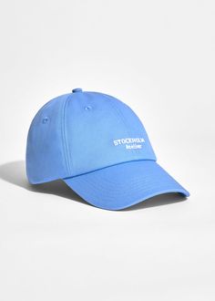 Nothing says casual quite like a baseball cap. This one has been made from cotton-twill embroidered with contrasting lettering and has a slider buckle at the back. Sporty Cotton Baseball Cap With Logo Patch, Spring Streetwear Six-panel Baseball Cap, Blue Six-panel Baseball Cap With Embroidered Logo, Blue Baseball Cap With Letter Patch, Blue Baseball Cap With Letter Patch And Curved Brim, Cotton Baseball Cap With Letter Embroidery, Cotton Visor Baseball Cap With Letter Embroidery, Blue Casual Baseball Cap With Letter Patch, Blue Baseball Cap With Embroidered Logo Visor