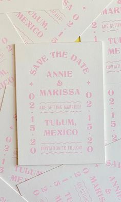 pink and white wedding save the date cards on top of each other with gold foil