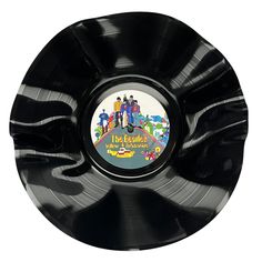 the beatles album cover on a black record