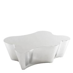 two white dishes sitting on top of each other