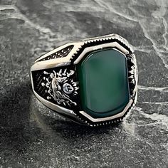 Handmade Silver Green Agate Gemstone Mens Ring , Ottoman Coat of Arms Ring , Ottoman Empire Ring , Ottoman Amblem Mens Ring , Gift For Him , Same Day For Shipping ✧ Product Details * Handmade İtem * Gender : Male / Female * Material : 925K Sterling Silver * Ring Weight : 10 Grams * Gemstone Type : Green Agate ✔ Usage Details * Silver jewelry is very sensitive to chemicals. It is recommended to keep away from chemical substances such as cream, bleach, deodorant, detergent. * Silver jewelry can also darken quickly in salt water, that is, in sea water. For this reason, it is best to remove them when swimming in the sea. ✔ Shipping * Your orders placed on weekdays are delivered to the cargo on the same day. Your orders placed on the weekend are delivered to the cargo on Monday. ✔ Other Details Ottoman Coat, Empire Ottoman, Islamic Jewelry, Chemical Substances, Mens Ring, Ottoman Empire, Green Agate, Agate Gemstone, Ring Collections