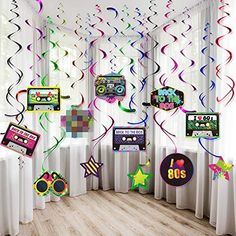 a room filled with lots of colorful streamers and decorations