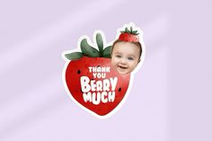 a baby with a strawberry sticker on it's head and the words thank you berry much