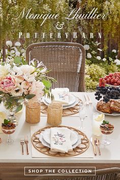 the table is set with flowers and waffles