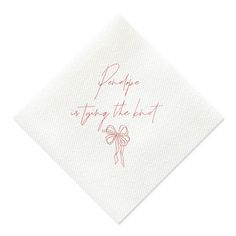 a white napkin with pink writing and a bow on the front that says, please staying the