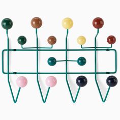 a rack with several different colored balls on it