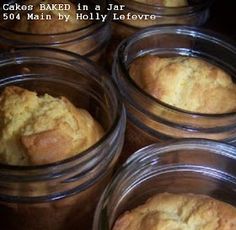 several glass jars filled with baked goods on top of a table