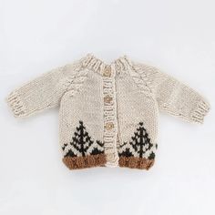 This beautiful sweater is accented with deep green trees and pecan brown ribbed trim. It's styled with cable trim raglan sleeves and wood buttons. Hand-knit, in natural colored yarn, it is cozy and warm. What a wonderful gift for any little person you know.• 100% Acrylic• Cold handwash• Hand knit in China Wood Buttons, Beautiful Sweater, Baby Cardigan, Garter Stitch, Green Trees, Softest Sweater, Baby Sweaters, Baby Outfits, Knit Hat