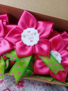 a box filled with pink and green bows