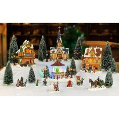 a christmas village with lots of trees and houses