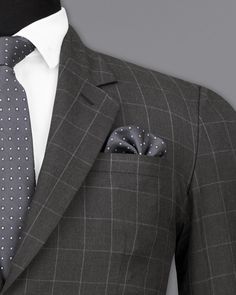 This Single Breasted Suit is a stylish and unique addition to any formal wardrobe. Made from high-quality materials, this suit features a striking windowpane checkered pattern that is perfect for making a statement. The single-breasted design adds a touch of sophistication, while the comfortable regular fit ensures all-day comfort. Ideal for formal occasions and weddings this suit is sure to impress everyone around you. In addition to being constructed from Imported Superior Fabrics, French crow Business Casual Single Breasted Suit Sets, Single Breasted Business Casual Suiting Sets, Business Casual Single-breasted Suit Set, Single Breasted Suiting Fabric Sets For Business Casual, Single Breasted Plaid Office Suits, Plaid Single-breasted Suits For Office, Plaid Single-breasted Office Suits, Classic Formal Plaid Blazer, Elegant Plaid Blazer For Business