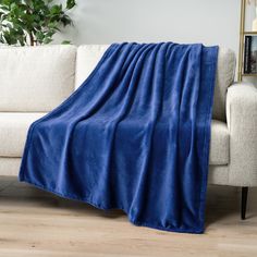 a couch with a blue blanket on it