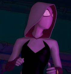 a woman in a black dress and pink hoodie with her hands on her hips