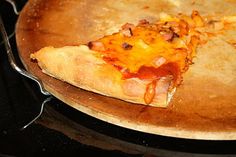 a slice of pizza sitting on top of a pan