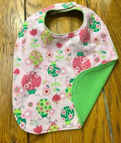 100% cotton flannel, fully-lined children's baby bib. Easy velcro closures. Washable and dryable. Boys, girls, and unisex. Playful Machine Washable Bib As Gift, Cute Machine Washable Bib As Gift, Playful Bib For Playtime, Washable Bib For Playtime, Pink Cotton Bib As A Gift, Pink Cotton Bib As Gift, Playful Washable Bib For Playtime, Cute Machine Washable Bibs For Playtime, Cute Handmade Cotton Bib