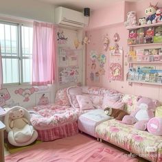 a room with pink walls and lots of stuffed animals on the couches in it