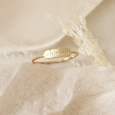 "\"...even as he chose us in him before the foundation of the world, that we should be holy and blameless before him. In love he predestined us for adoption as sons through Jesus Christ, according to the purpose of his will...\" Ephesians 1:4-5 * This listing is for one (1) ring that is engraved. Shown with our other engraved bar rings. * Measurements: 1mm band, 3.5mm x 11mm bar * Finish: 18K gold over surgical or polished surgical steel. Tarnish resistant and waterproof * Nickel Free and Lead F Elevated Faith Rings, Spiritual Personalized Promise Rings, Christian Gifts For Him, Purity Ring Christian, Jesus Jewelry, Bar Rings, Jesus Ring, Christian Jewelry For Women, Christian Rings