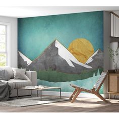 a living room with a mountain mural on the wall