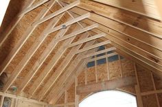 the inside of a house being built with wood framing on the walls and ceiling beams