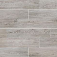 grey wood flooring that looks like it has been made from the same material as the tile