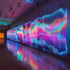 an art installation with colorful lights on the wall