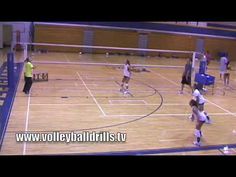 volleyball players are on the court during a game