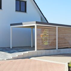 a white house with wooden slats on the side