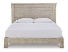 a bed with white sheets and pillows on top of it, against a white background