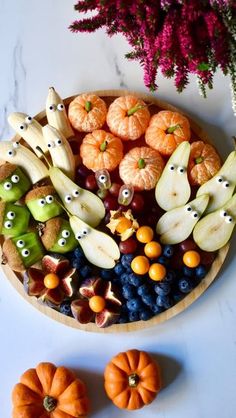 an assortment of fruits and vegetables with eyes on them