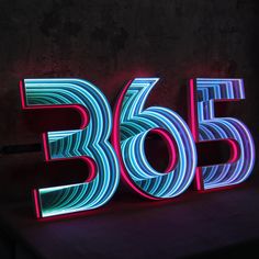 a neon sign that reads 3655 in front of a dark background