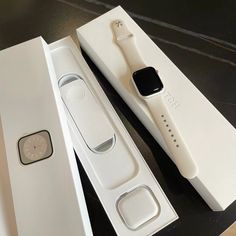 an apple watch is in its box and next to it's new packaging on the table