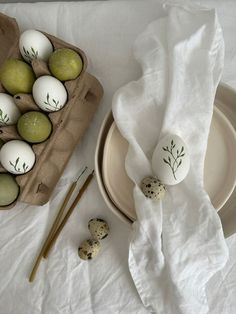 some eggs sitting on top of a white table